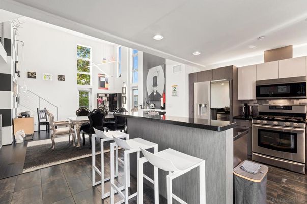 Dining room, Interior, Kitchen, Pendant Lights, Recessed Lighting, Stainless Steel Appliances, Wood Texture Flooring