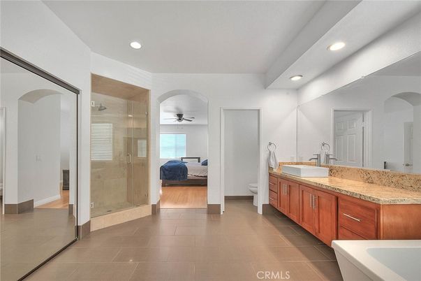 Bathroom, Bedroom, Dual Sink Vanities, Glass Shower, Interior, Recessed Lighting, Wood Texture Flooring