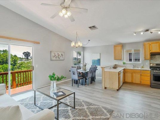 Chandelier, Dining room, Interior, Kitchen, Living room, Stainless Steel Appliances, Wood Texture Flooring