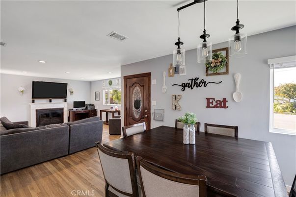 Dining room, Fireplace, Interior, Living room, Pendant Lights, Recessed Lighting, Wood Texture Flooring