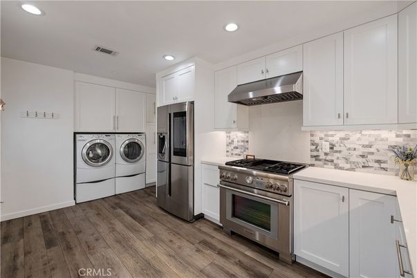 Interior, Kitchen, Recessed Lighting, Stainless Steel Appliances, Washer, Wood Texture Flooring