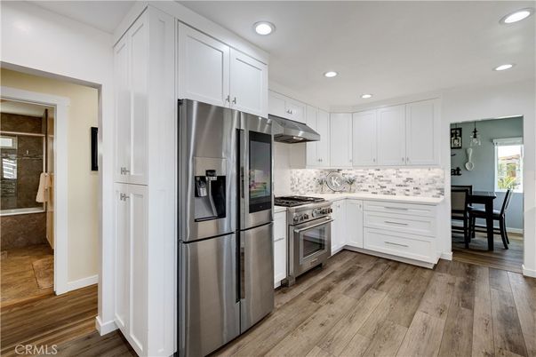 Dining room, Interior, Kitchen, Recessed Lighting, Stainless Steel Appliances, Wood Texture Flooring