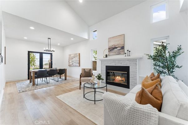Dining room, Fireplace, Interior, Living room, Pendant Lights, Recessed Lighting, Wood Texture Flooring