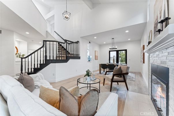 Dining room, Fireplace, Interior, Living room, Pendant Lights, Recessed Lighting, Wood Texture Flooring