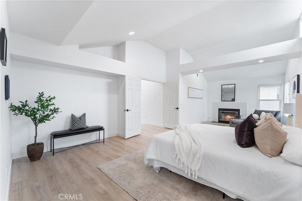 Bedroom, Fireplace, Interior, Recessed Lighting, Wood Texture Flooring