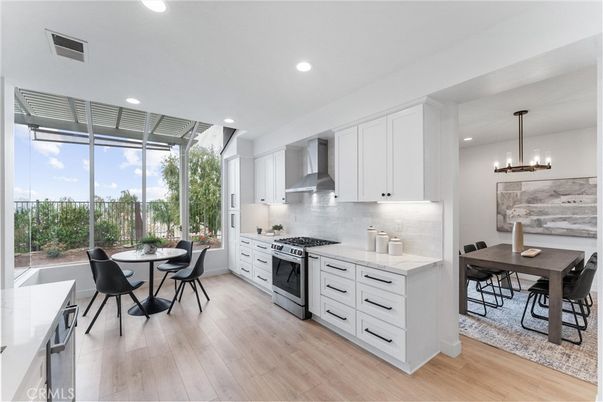 Chandelier, Dining room, Interior, Kitchen, Pendant Lights, Recessed Lighting, Stainless Steel Appliances, Wood Texture Flooring