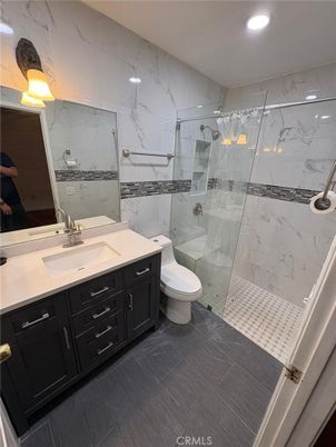Bathroom, Dual Sink Vanities, Glass Shower, Interior, Marble Walls, Recessed Lighting