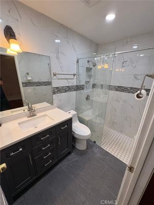 Bathroom, Dual Sink Vanities, Glass Shower, Interior, Marble Walls, Recessed Lighting