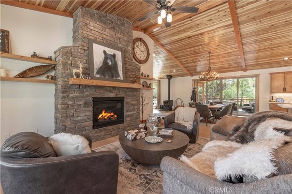 Chandelier, Dining room, Fireplace, Interior, Living room, Recessed Lighting, Stone Walls, Wooden Beams, Wooden Ceilings