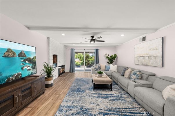 Fireplace, Interior, Living room, Recessed Lighting, Stone Walls, Water, Wood Texture Flooring