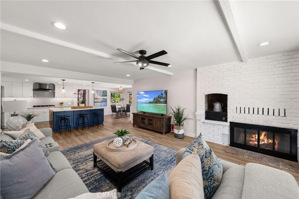 Fireplace, Interior, Kitchen, Living room, Pendant Lights, Recessed Lighting, Stainless Steel Appliances, Stone Walls, Wood Texture Flooring
