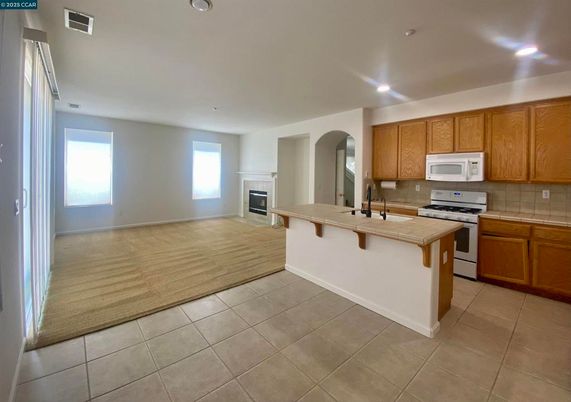 Fireplace, Interior, Kitchen, Recessed Lighting, Wood Texture Flooring