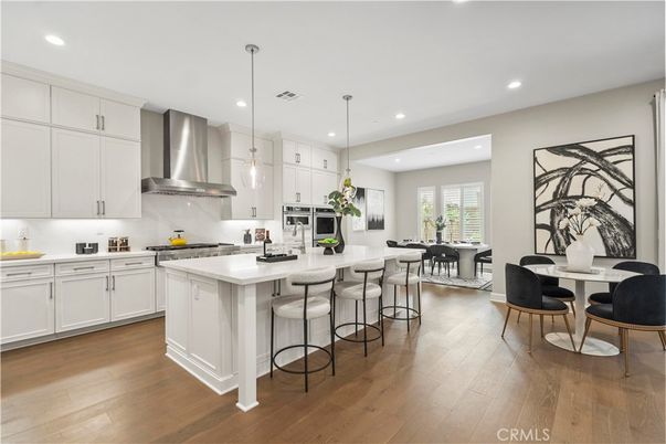 Dining room, Interior, Kitchen, Pendant Lights, Recessed Lighting, Stainless Steel Appliances, Wood Texture Flooring