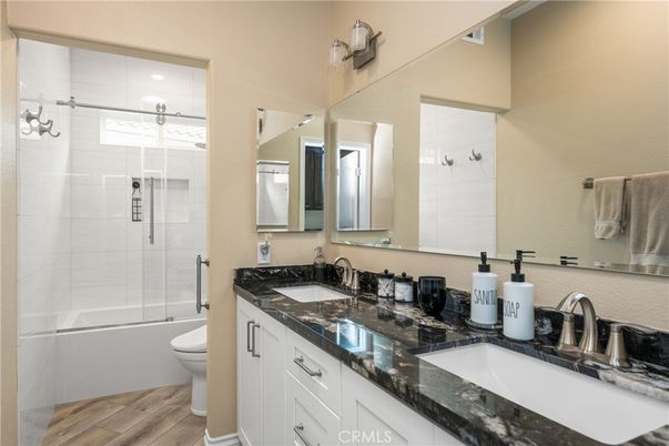 Bathroom, Dual Sink Vanities, Glass Shower, Interior, Wood Texture Flooring