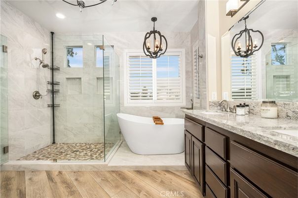 Bathroom, Dual Sink Vanities, Free Standing Baths, Glass Shower, Interior, Pendant Lights, Recessed Lighting, Wood Texture Flooring