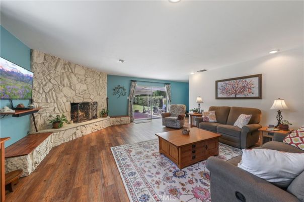 Fireplace, Interior, Living room, Recessed Lighting, Stone Walls, Wood Texture Flooring