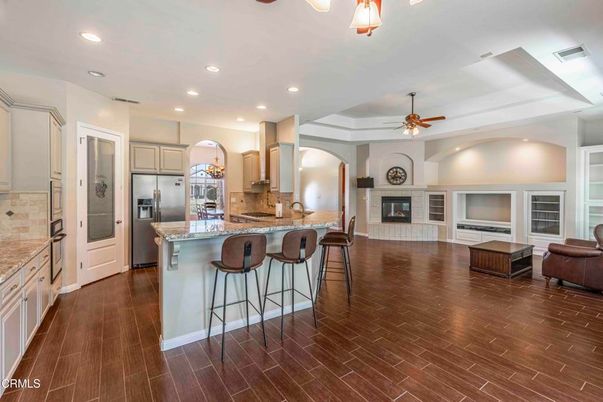 Fireplace, Interior, Kitchen, Living room, Recessed Lighting, Stainless Steel Appliances, Wood Texture Flooring