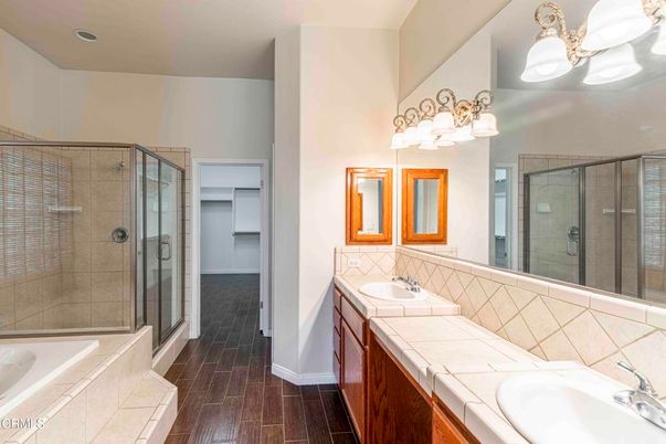 Bathroom, Dual Sink Vanities, Glass Shower, Interior, Recessed Lighting, Tile Countertops, Wood Texture Flooring