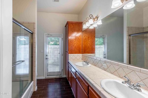 Bathroom, Dual Sink Vanities, Glass Shower, Interior, Tile Countertops, Wood Texture Flooring
