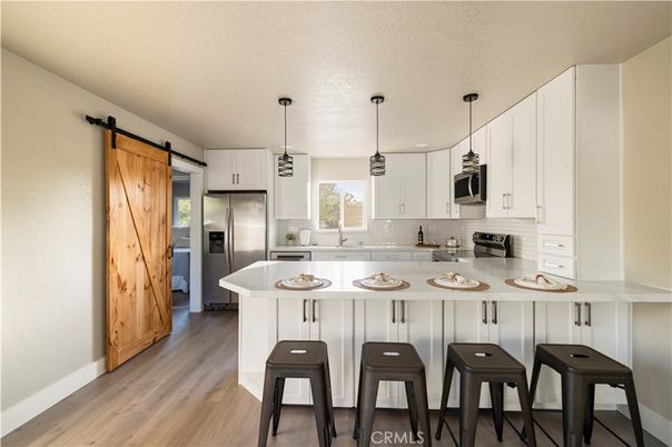 Interior, Kitchen, Pendant Lights, Recessed Lighting, Stainless Steel Appliances, Wood Texture Flooring