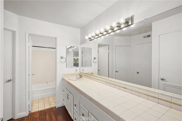 Bathroom, Dual Sink Vanities, Interior, Tile Countertops, Wood Texture Flooring