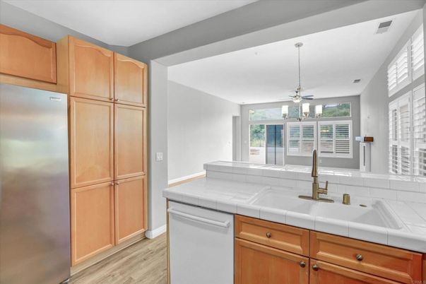 Interior, Kitchen, Pendant Lights, Tile Countertops, Wood Texture Flooring