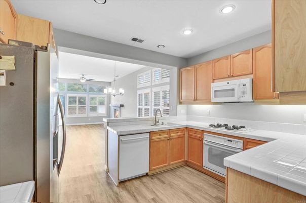 Chandelier, Interior, Kitchen, Pendant Lights, Recessed Lighting, Tile Countertops, Wood Texture Flooring