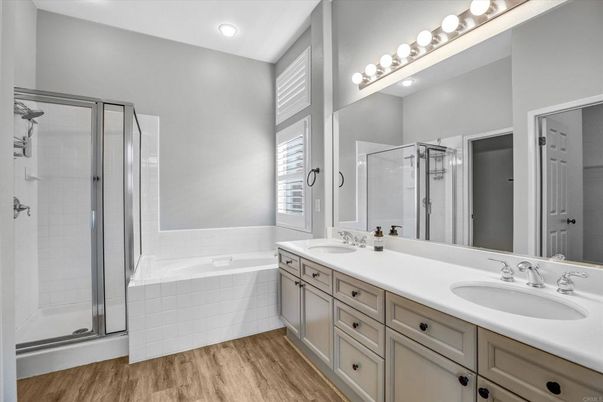 Bathroom, Dual Sink Vanities, Glass Shower, Interior, Recessed Lighting, Wood Texture Flooring