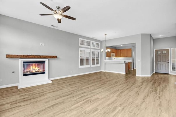 Empty room, Fireplace, Interior, Kitchen, Pendant Lights, Recessed Lighting, Wood Texture Flooring