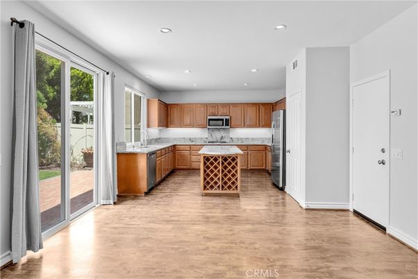 Interior, Kitchen, Marble Walls, Recessed Lighting, Stainless Steel Appliances, Wood Texture Flooring