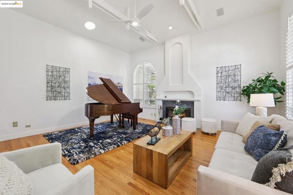 Fireplace, Interior, Living room, Piano, Recessed Lighting, Wood Texture Flooring