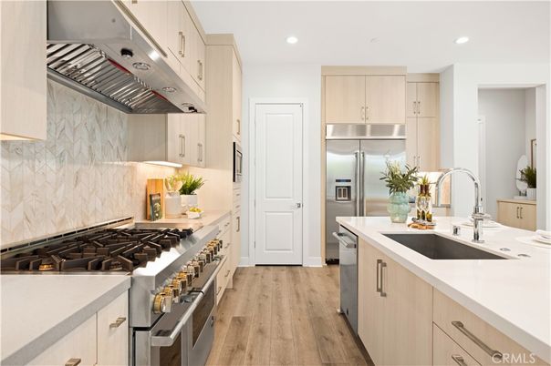 Interior, Kitchen, Marble Walls, Recessed Lighting, Stainless Steel Appliances, Wood Texture Flooring