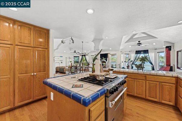 Interior, Kitchen, Recessed Lighting, Tile Countertops, Wood Texture Flooring
