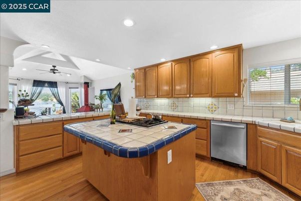 Interior, Kitchen, Recessed Lighting, Tile Countertops, Wood Texture Flooring