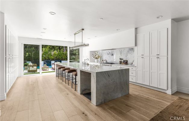 Interior, Kitchen, Marble Walls, Pendant Lights, Recessed Lighting, Wood Texture Flooring