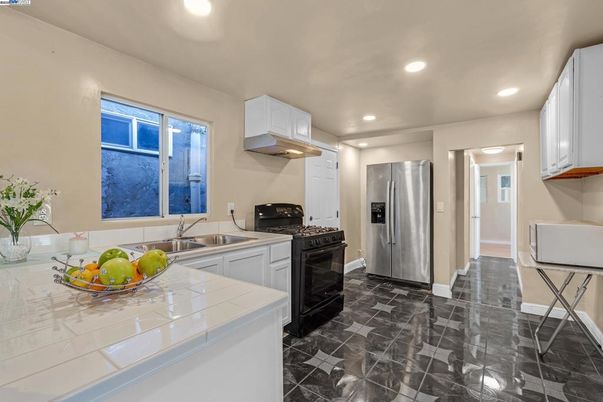 Interior, Kitchen, Marble, Recessed Lighting, Stainless Steel Appliances, Tile Countertops