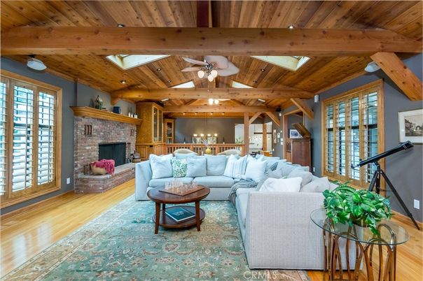 Chandelier, Dining room, Fireplace, Interior, Living room, Recessed Lighting, Wooden Beams, Wooden Ceilings, Wood Texture Flooring