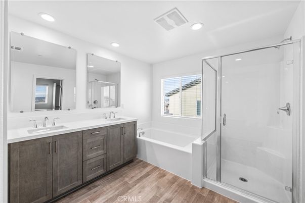 Bathroom, Dual Sink Vanities, Glass Shower, Interior, Recessed Lighting, Wood Texture Flooring