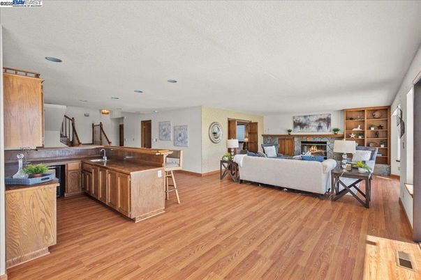 Fireplace, Interior, Kitchen, Living room, Recessed Lighting, Wood Texture Flooring