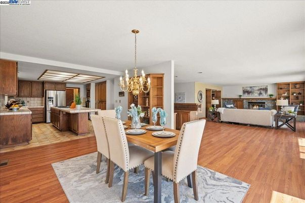 Chandelier, Dining room, Fireplace, Interior, Kitchen, Living room, Stainless Steel Appliances, Wood Texture Flooring
