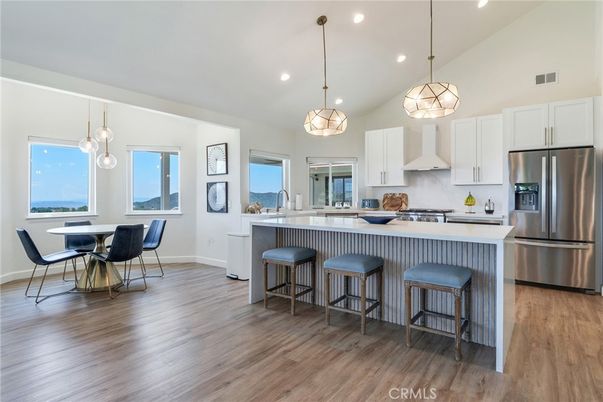 Dining room, Interior, Kitchen, Pendant Lights, Recessed Lighting, Stainless Steel Appliances, Water, Wood Texture Flooring