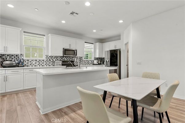 Dining room, Interior, Kitchen, Recessed Lighting, Stainless Steel Appliances, Wood Texture Flooring