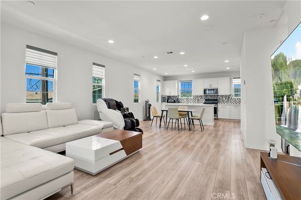 Dining room, Interior, Kitchen, Living room, Recessed Lighting, Stainless Steel Appliances, Wood Texture Flooring