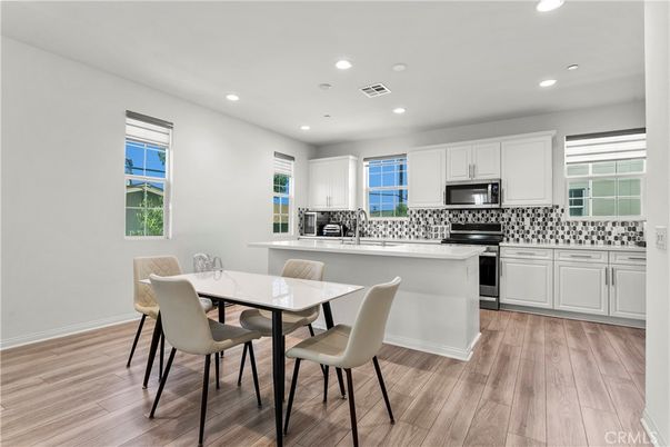 Dining room, Interior, Kitchen, Recessed Lighting, Stainless Steel Appliances, Wood Texture Flooring
