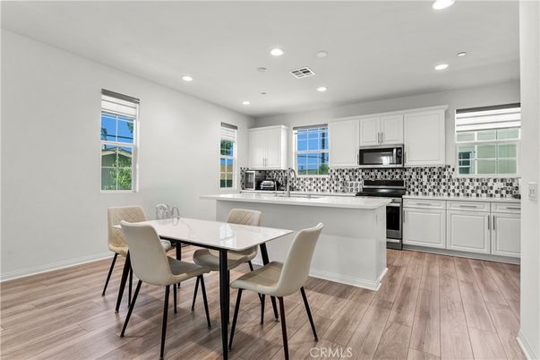 Dining room, Interior, Kitchen, Recessed Lighting, Stainless Steel Appliances, Wood Texture Flooring
