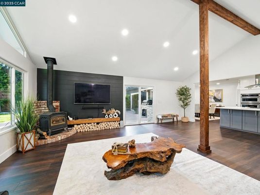 Fireplace, Interior, Living room, Recessed Lighting, Stainless Steel Appliances, Wooden Beams, Wood Texture Flooring