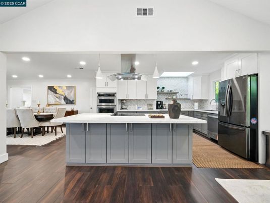 Dining room, Interior, Kitchen, Pendant Lights, Recessed Lighting, Stainless Steel Appliances, Wood Texture Flooring