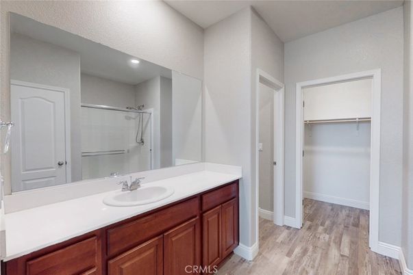 Bathroom, Glass Shower, Interior, Recessed Lighting, Walk-in Closets, Wood Texture Flooring