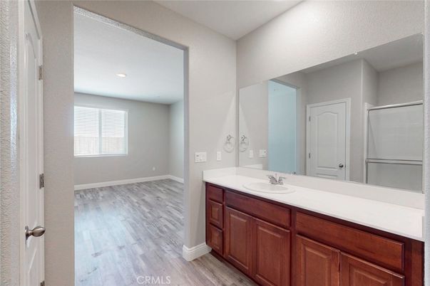 Bathroom, Dual Sink Vanities, Interior, Recessed Lighting, Wood Texture Flooring