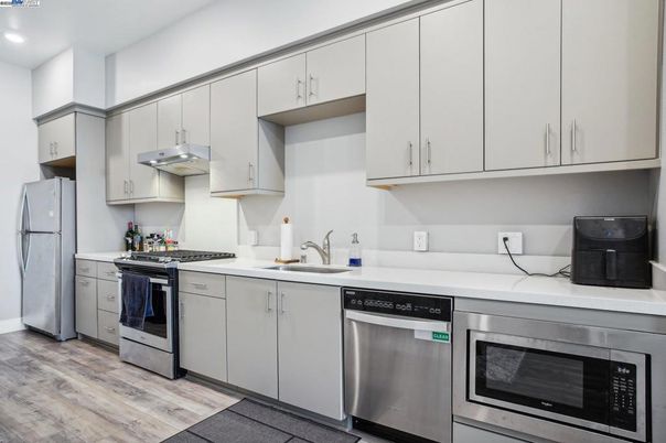 Interior, Kitchen, Recessed Lighting, Stainless Steel Appliances, Wood Texture Flooring